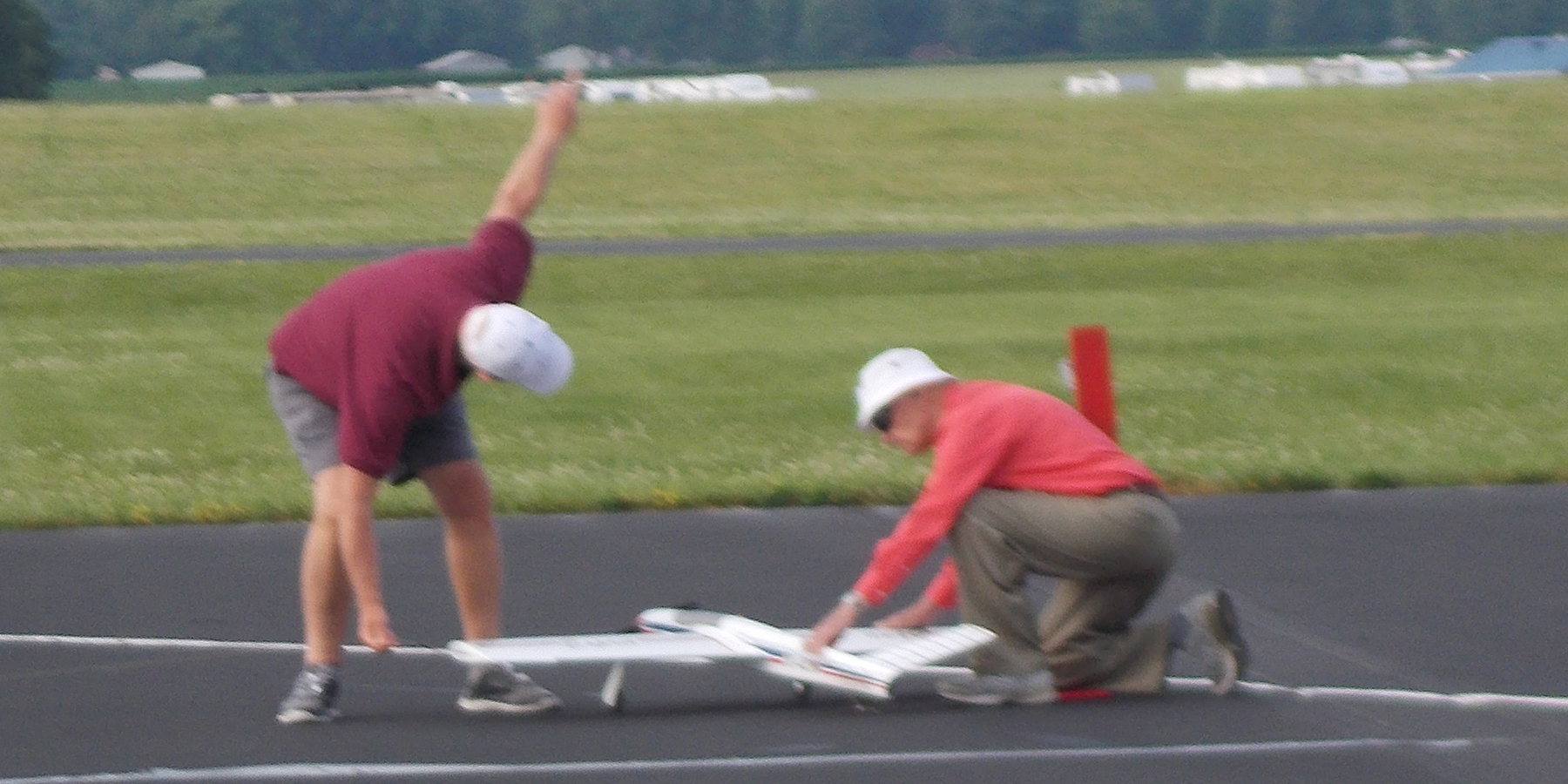 5.	Dennis Adimisin gives the signal to start, while Wesly Dick (age 90) launches. I hope that I’m able to launch at his age.