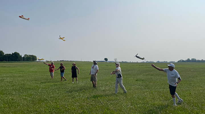 A mass launch during the first round of FAC Low Wing Military Trainer. Wally Farrell notches the win after three flight heats.