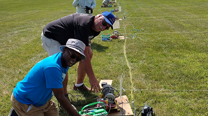 Charles Thomas, Contest Director Wally Adasczik, and Bob Burson setting up the winch lines Friday afternoon for the weekend’s Quadfecta competition.